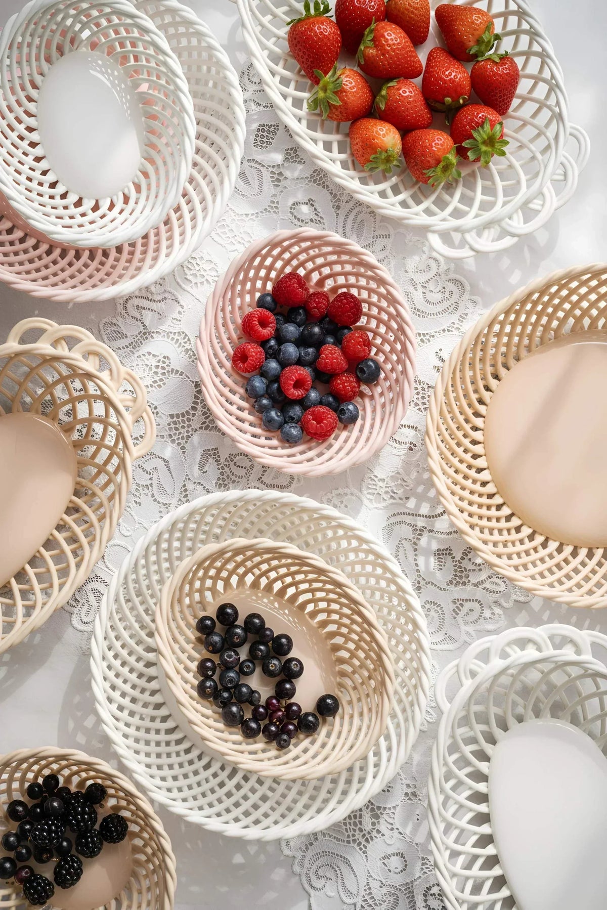 Hand-Woven Ceramic Basket, oval woven dish in white, beige and soft pink with an airy interlaced design and glossy finish.