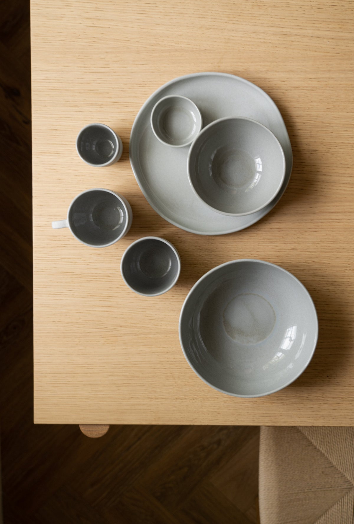 Handmade porcelain bowl in gray sky color with glossy glaze and smooth exterior