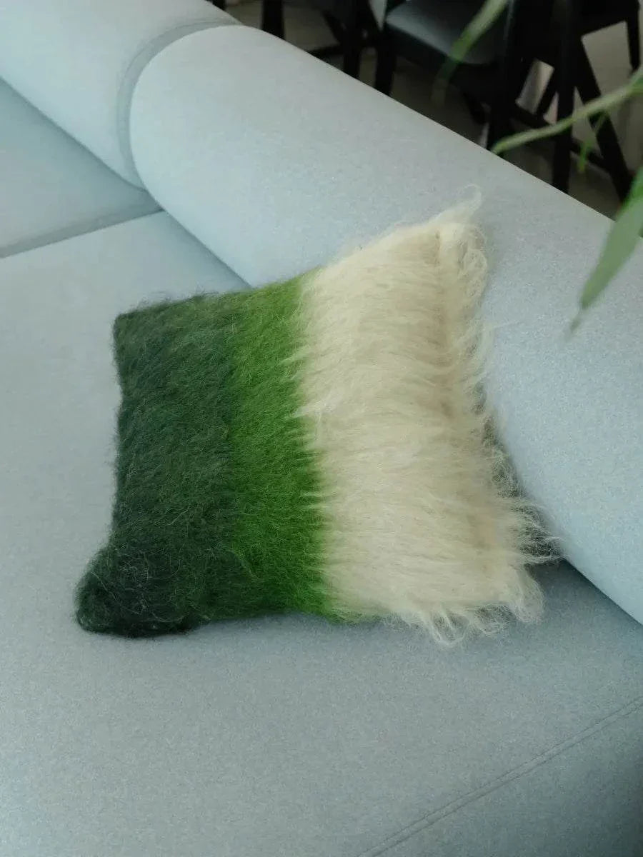 Emerald, green, and cream handwoven wool pillow with brushed texture and traditional craftsmanship