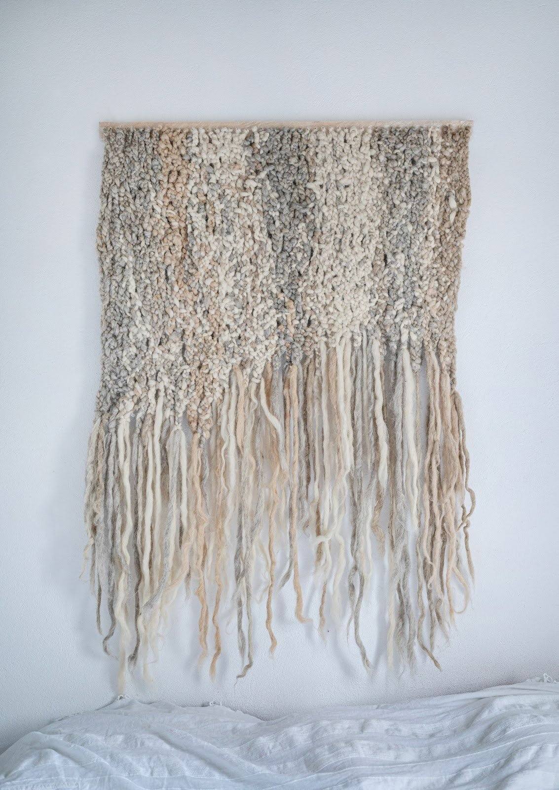 Handwoven wool wall hanging in neutral tones made of 100% sheep wool with traditional smooth hand weaving technique