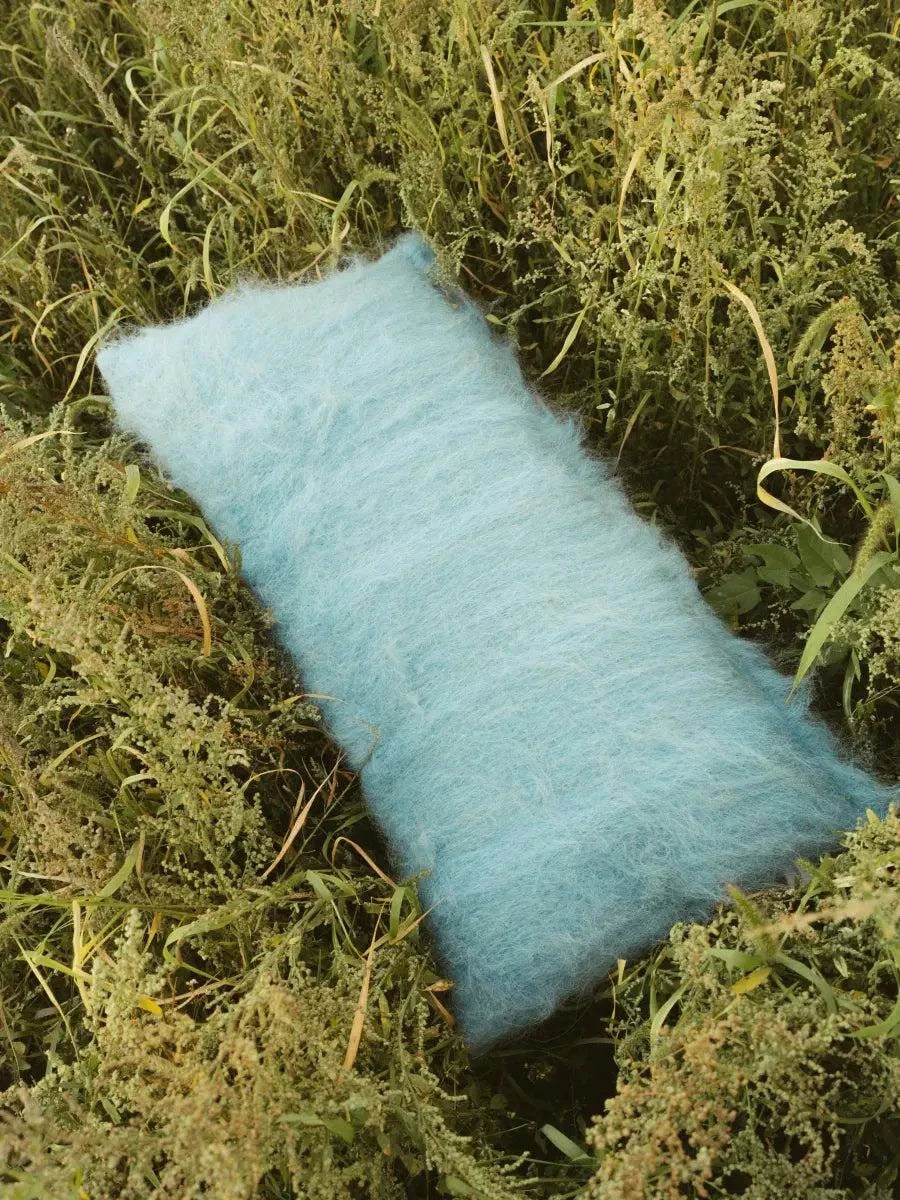 Sky blue handwoven wool pillow with brushed texture on cotton base