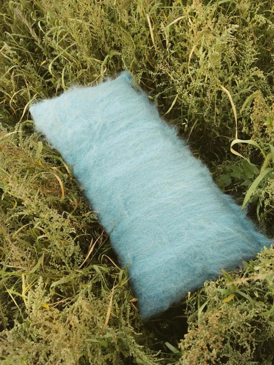 Sky blue handwoven wool pillow with brushed texture on cotton base