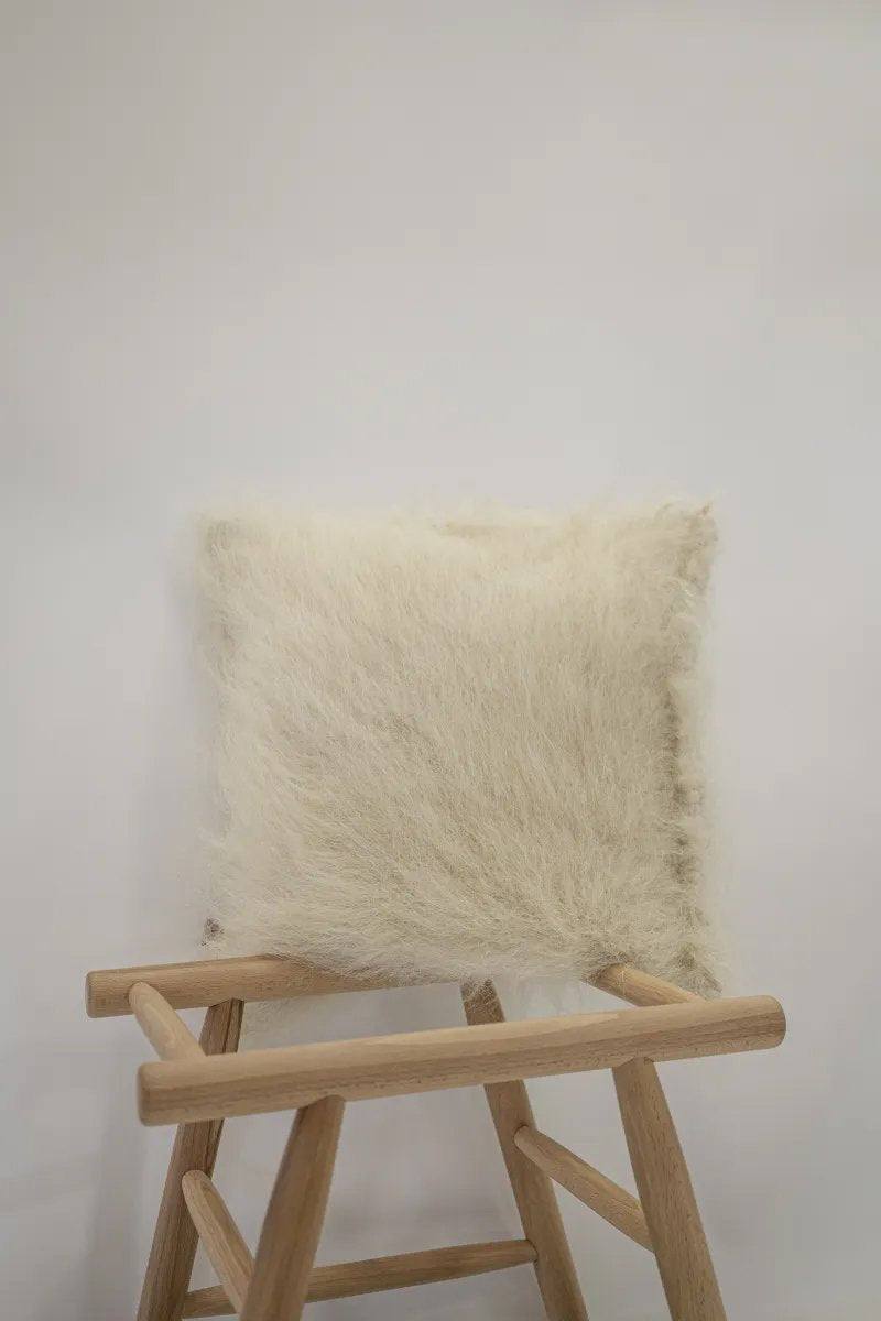 Handwoven organic wool pillow in brushed wood pattern, 18x18 inches, soft and supportive decorative cushion