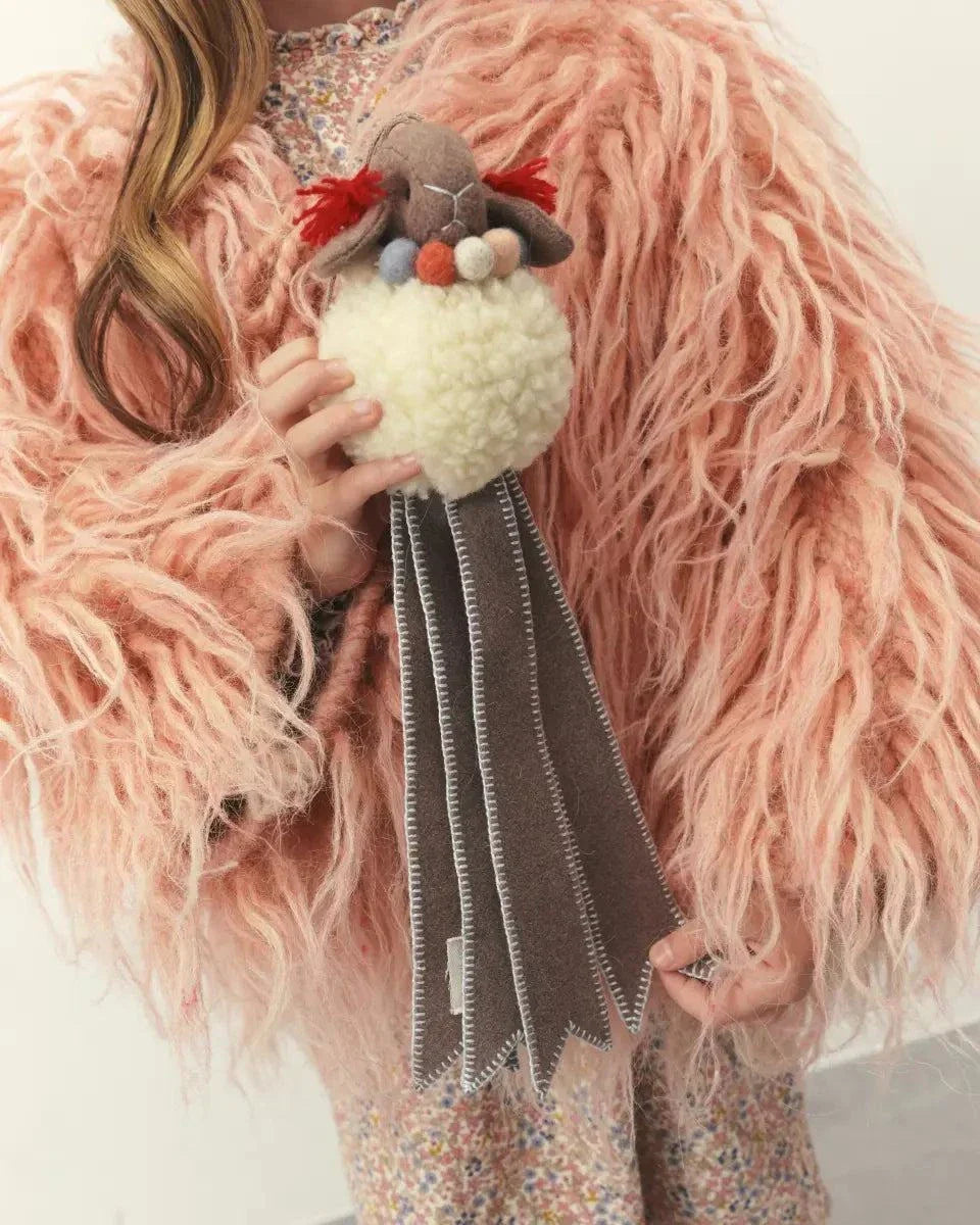 Wool Lamb Toy with a fluffy cream wool body, gray fleece face, colorful felt details and long striped fabric legs
