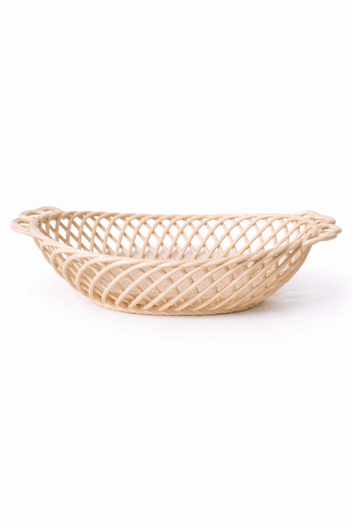 Ceramic Oval Basket in glossy pale beige porcelain, with an airy hand-woven lattice and sculptural oval shape.