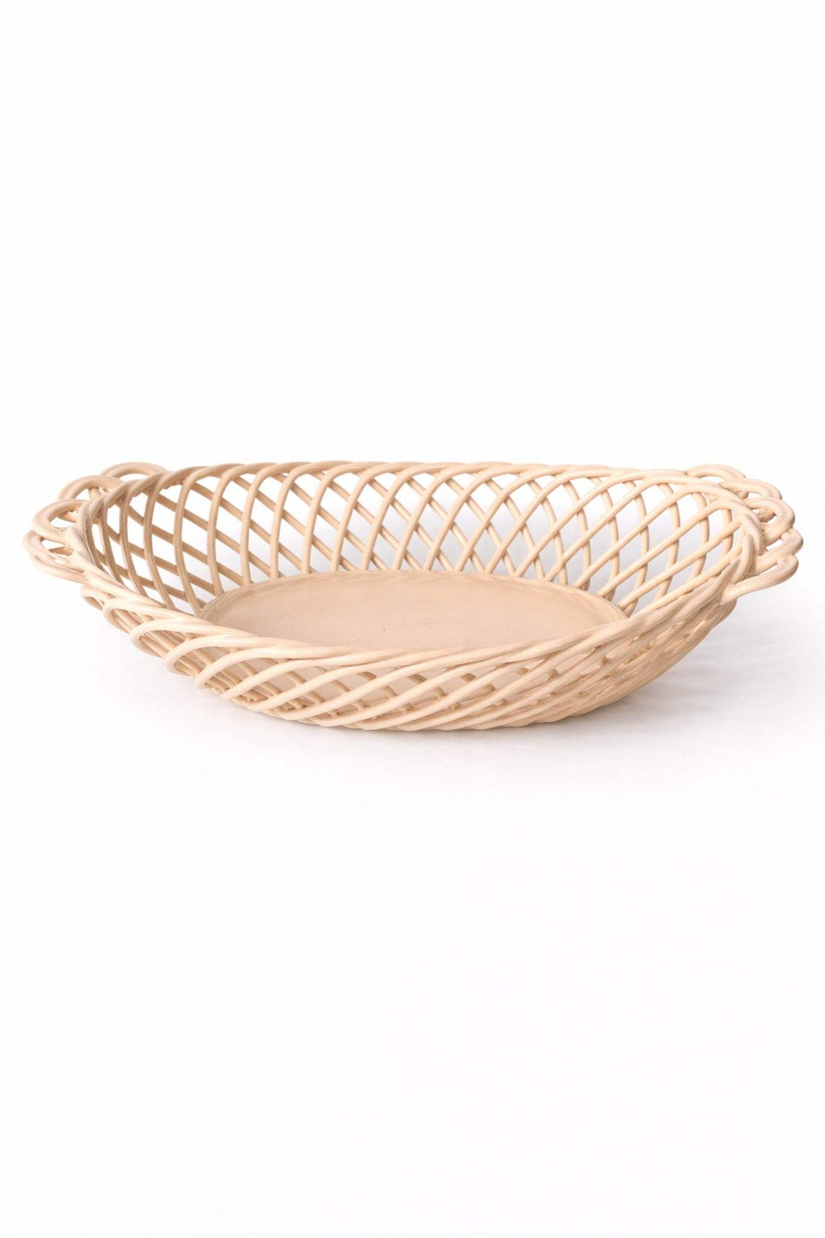 Ceramic Oval Basket in glossy beige porcelain, with an airy hand-woven lattice and solid oval base.