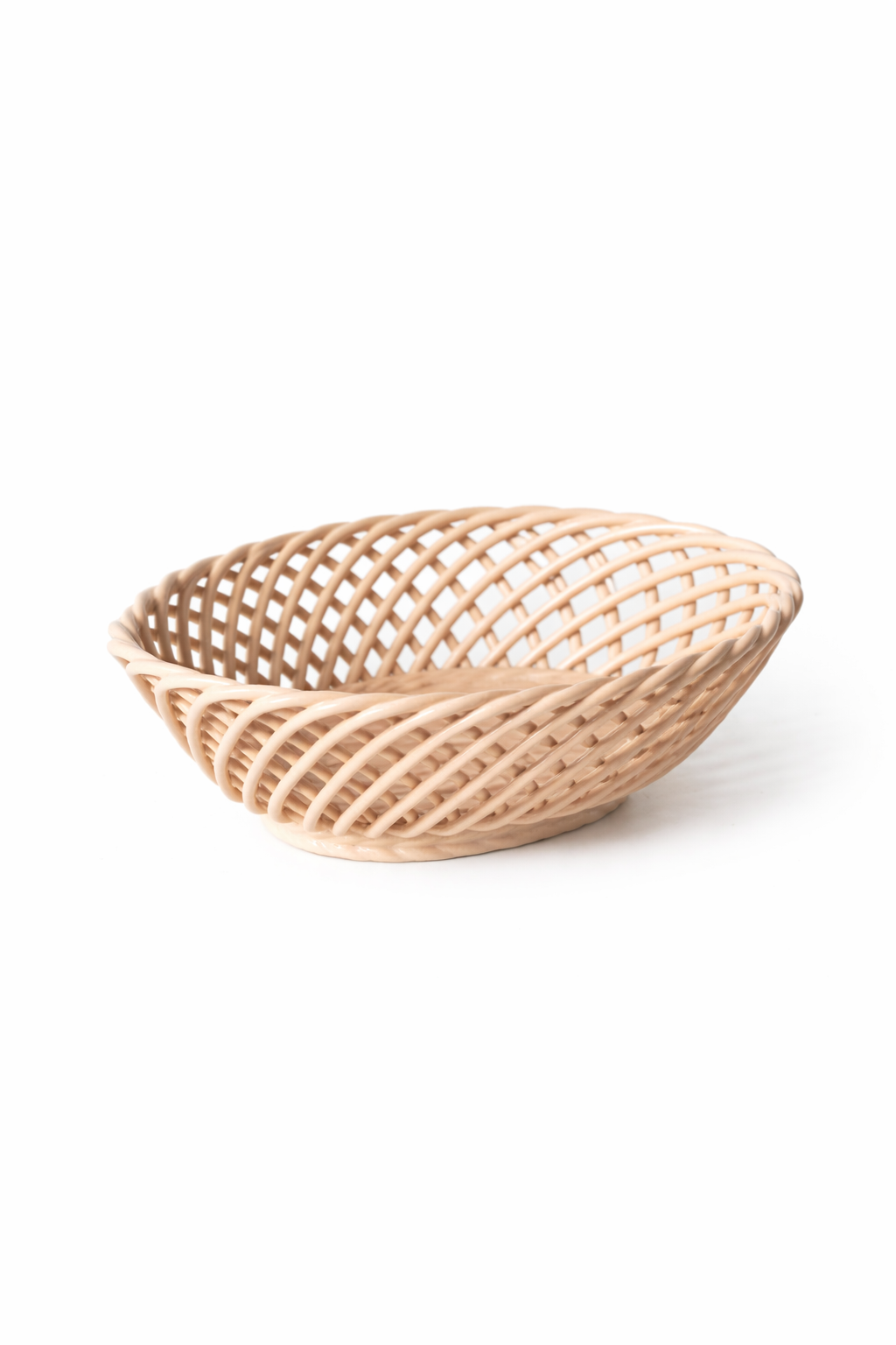 Hand-Woven Ceramic Basket in glossy pale beige porcelain, with an oval shape and airy interlaced strips.