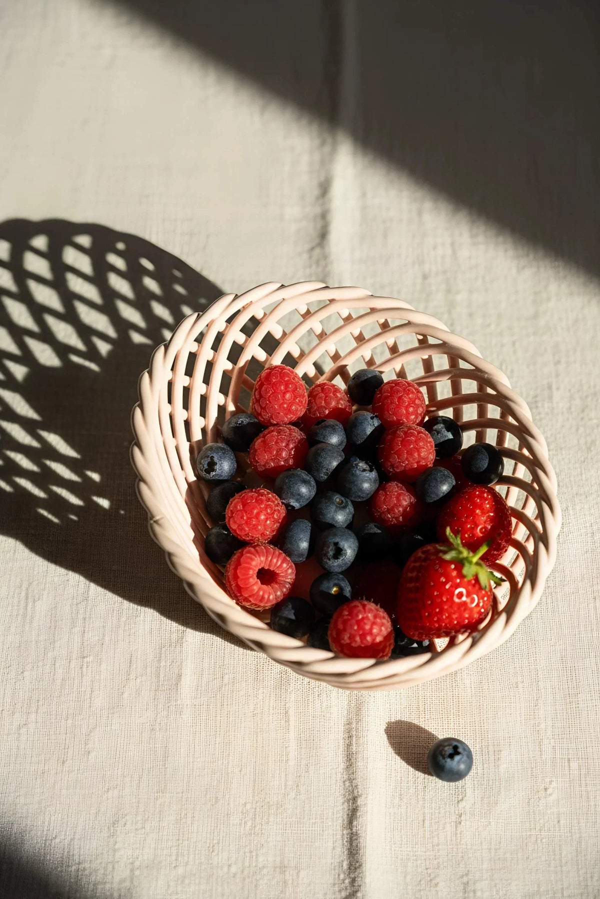 Hand-Woven Ceramic Basket, pale pink glossy porcelain dish with an airy interlaced lattice weave and oval shape