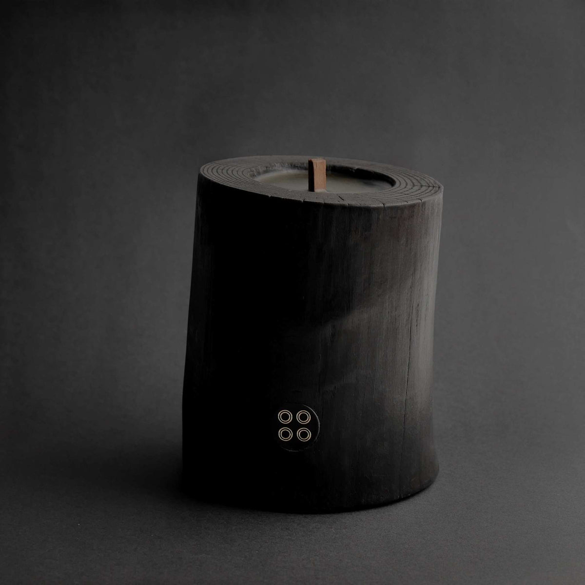 Black Illusions Wood Candle made of charred polished wood with multi-layer wick and natural beeswax coating