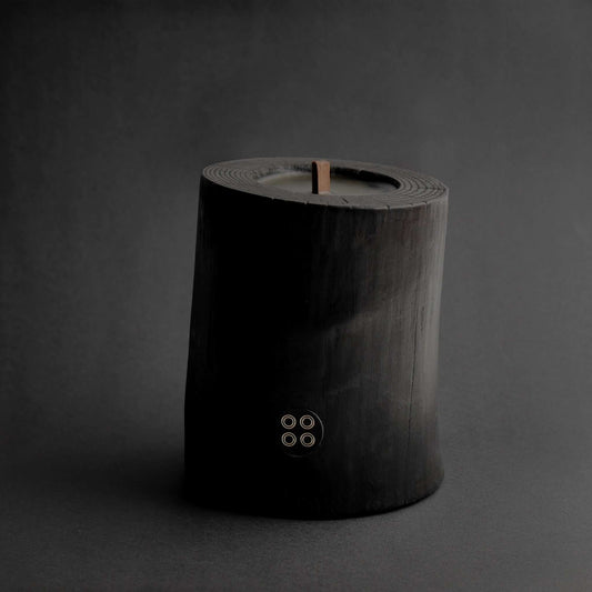Black Illusions Wood Candle made of charred polished wood with multi-layer wick and natural beeswax coating