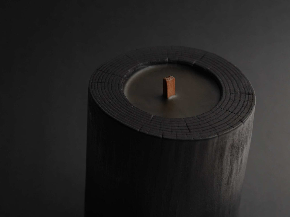 Black Illusions Wood Candle made of charred polished wood with multi-layer wick and beeswax coating