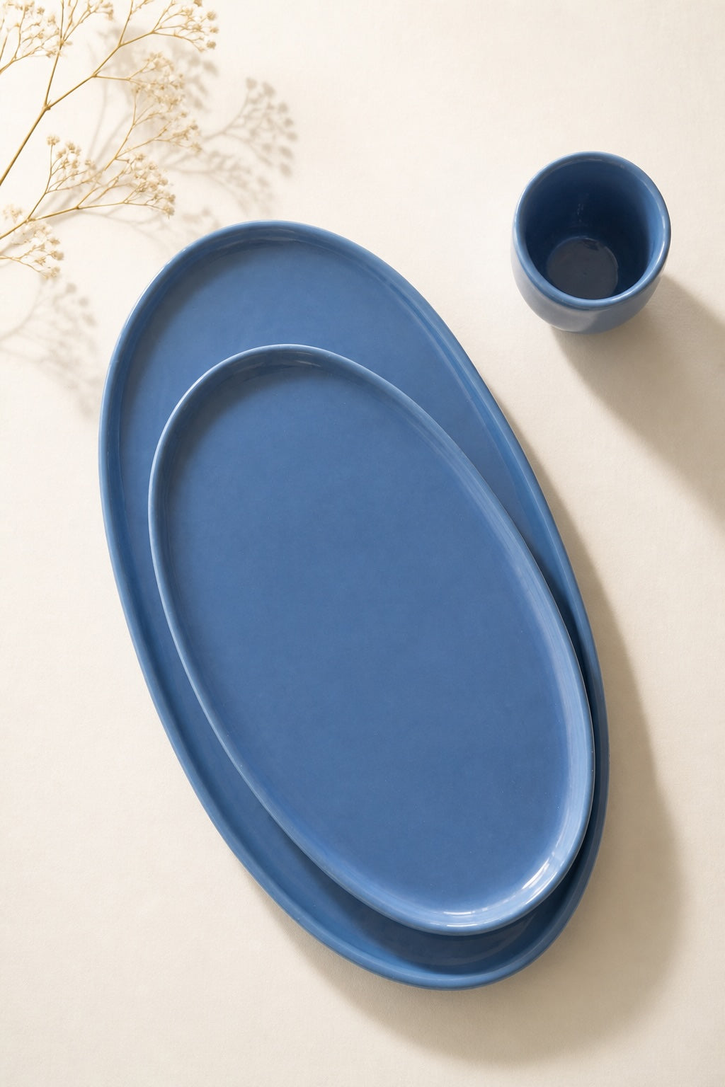 Oval Serving Platter set in dusty blue glazed porcelain, with two nested oval dishes and a matching small cup.