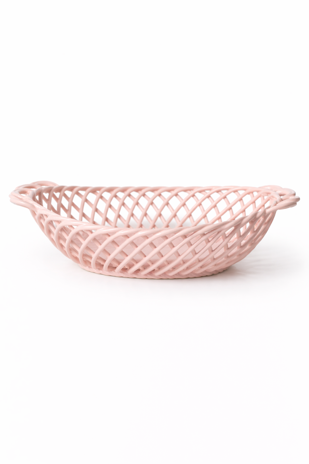 Ceramic Oval Basket in glossy soft pink porcelain, with an airy woven lattice design and oval shape.
