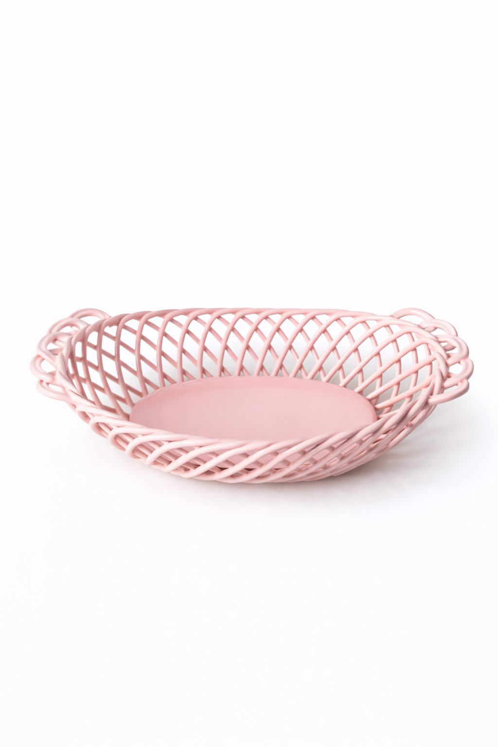 Ceramic Oval Basket in glossy soft pink porcelain, with an airy hand-woven lattice and solid oval base.