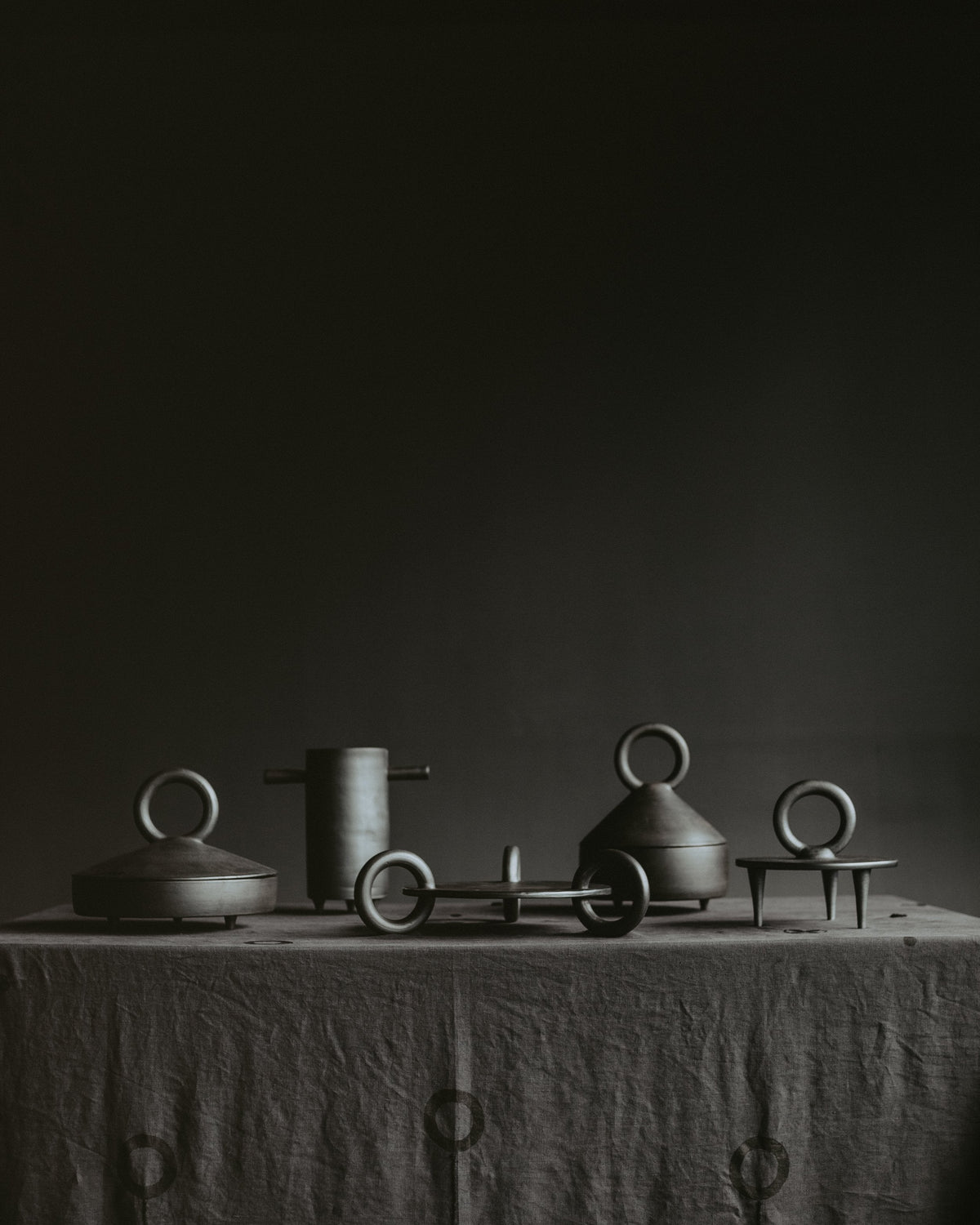 Shallow serving bowl with lid made of black smoked ceramics, handmade in Ukraine