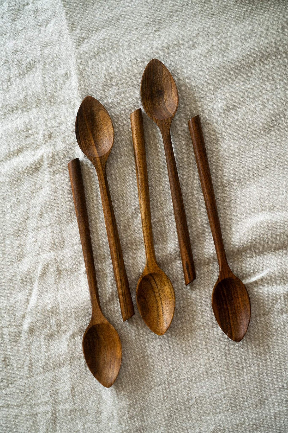 Soup Walnut Wood Spoon with rich brown tones and natural grain, hand-carved with a long handle and rounded bowl.