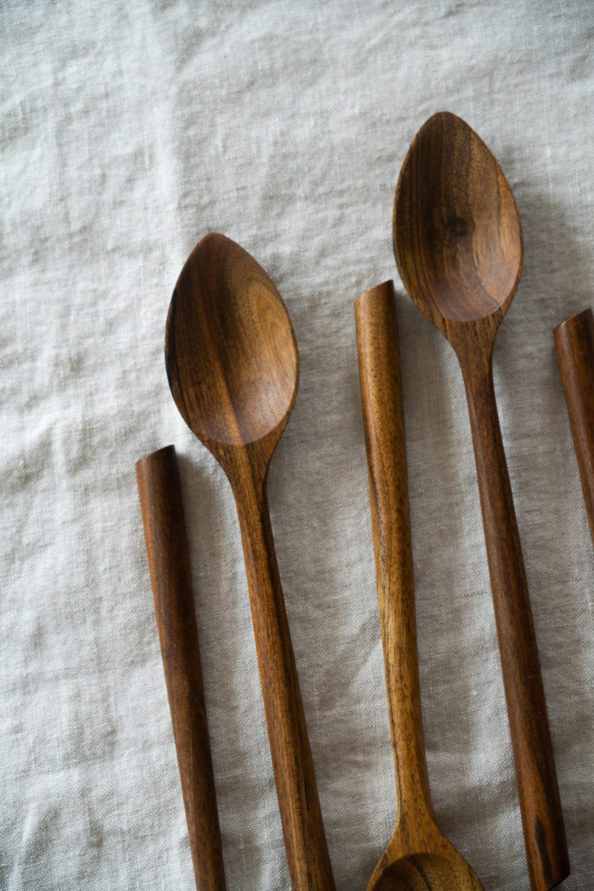 Soup Walnut Wood Spoon in warm brown hand-carved walnut, with natural grain and a deep oval bowl for serving soup.