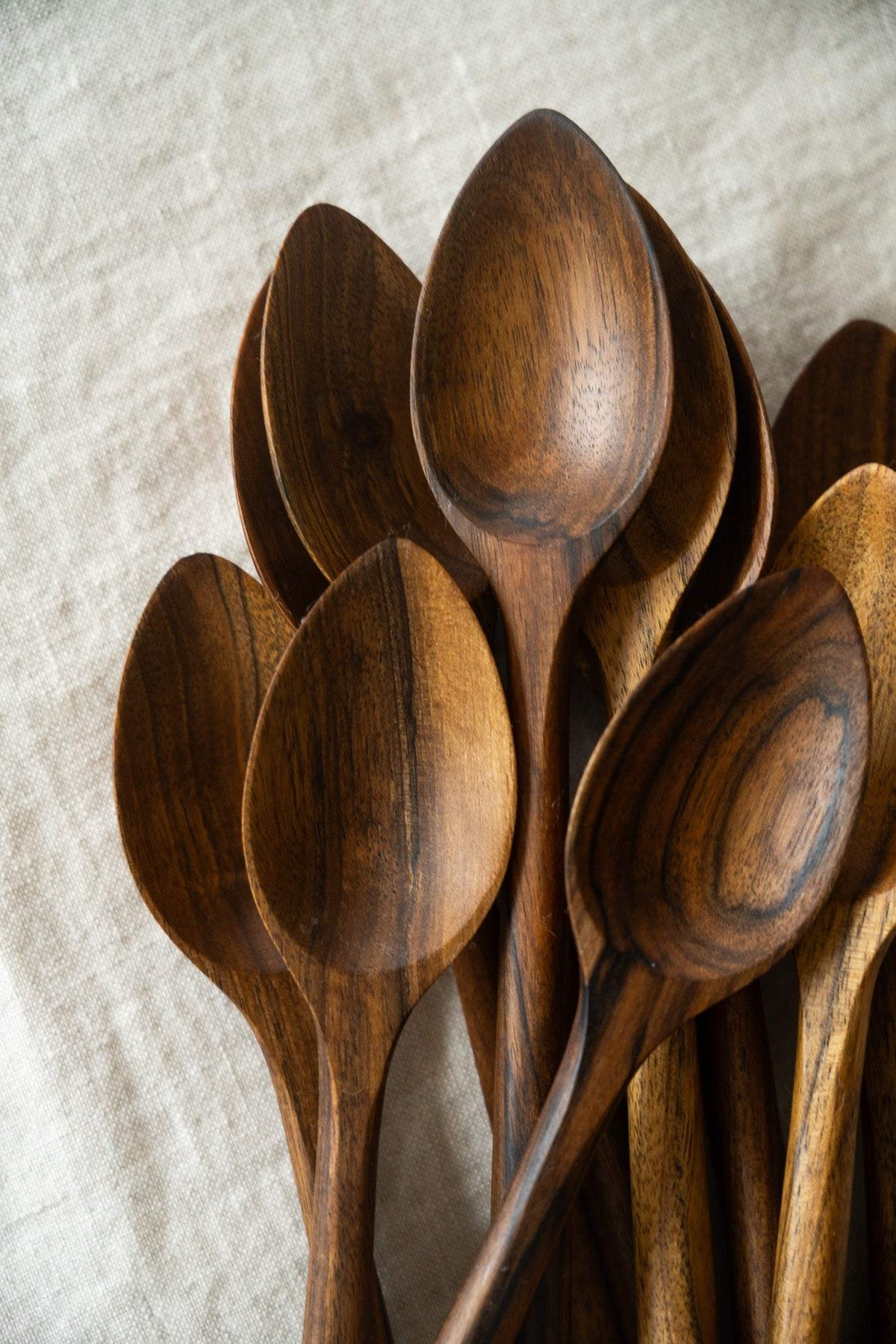 Soup Walnut Wood Spoon with a deep bowl, hand-carved from warm brown walnut wood with varied natural grain patterns.