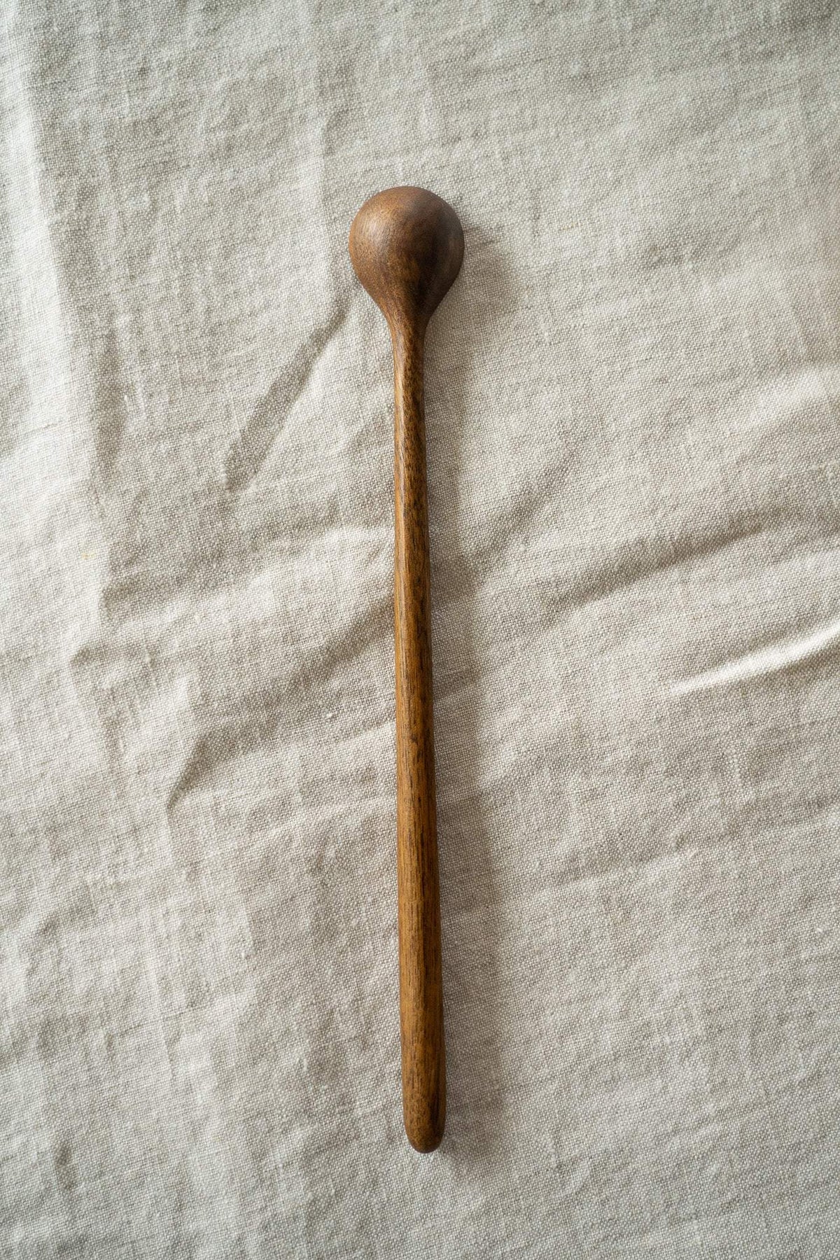 Hand carved walnut wood long coffee spoon with smooth finish and tall handle