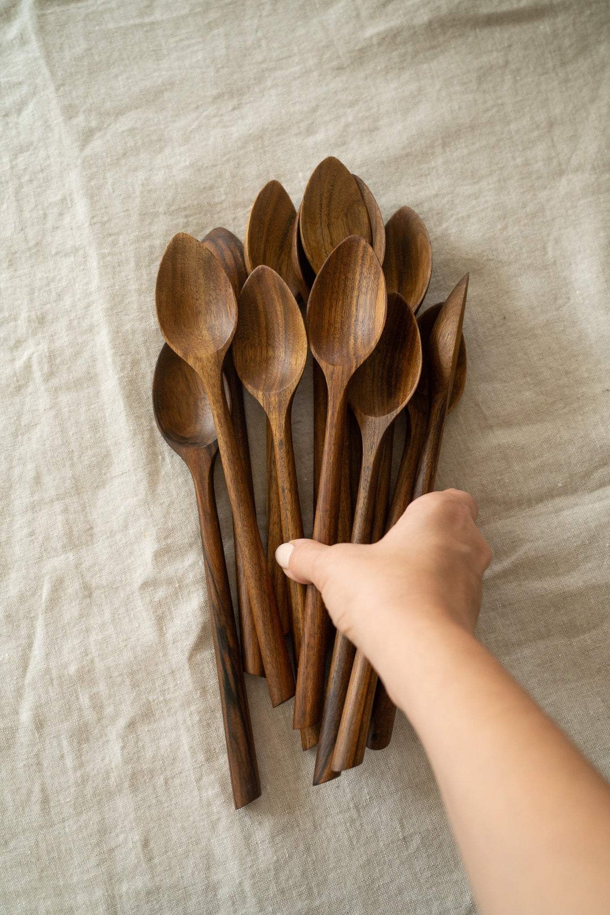 Soup Walnut Wood Spoon, a hand-carved dark brown wooden spoon with a smooth bowl and distinctive natural grain.