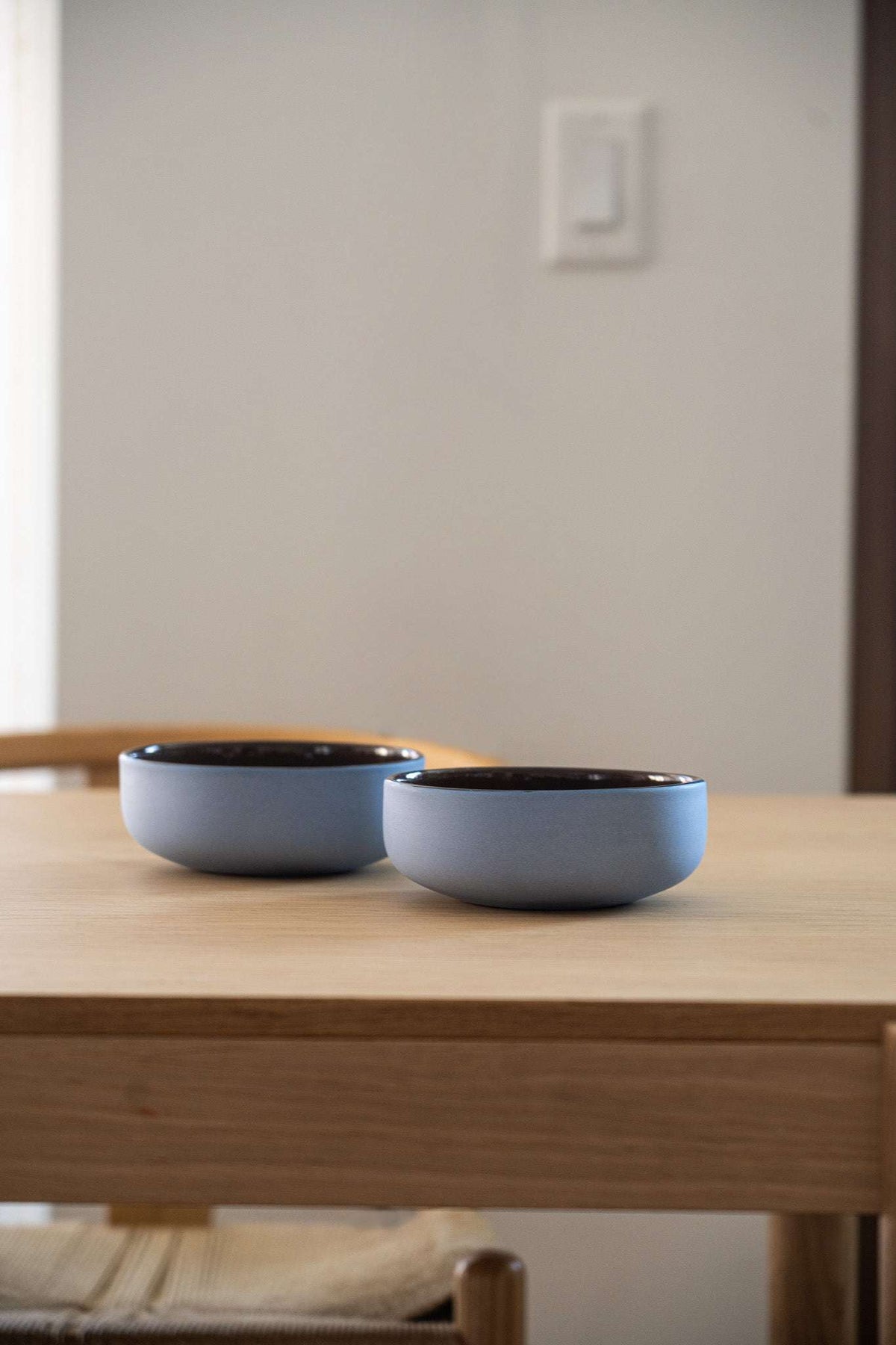 Handmade porcelain bowl with forget-me-not exterior and chocolate interior glaze, food-safe and dishwasher safe