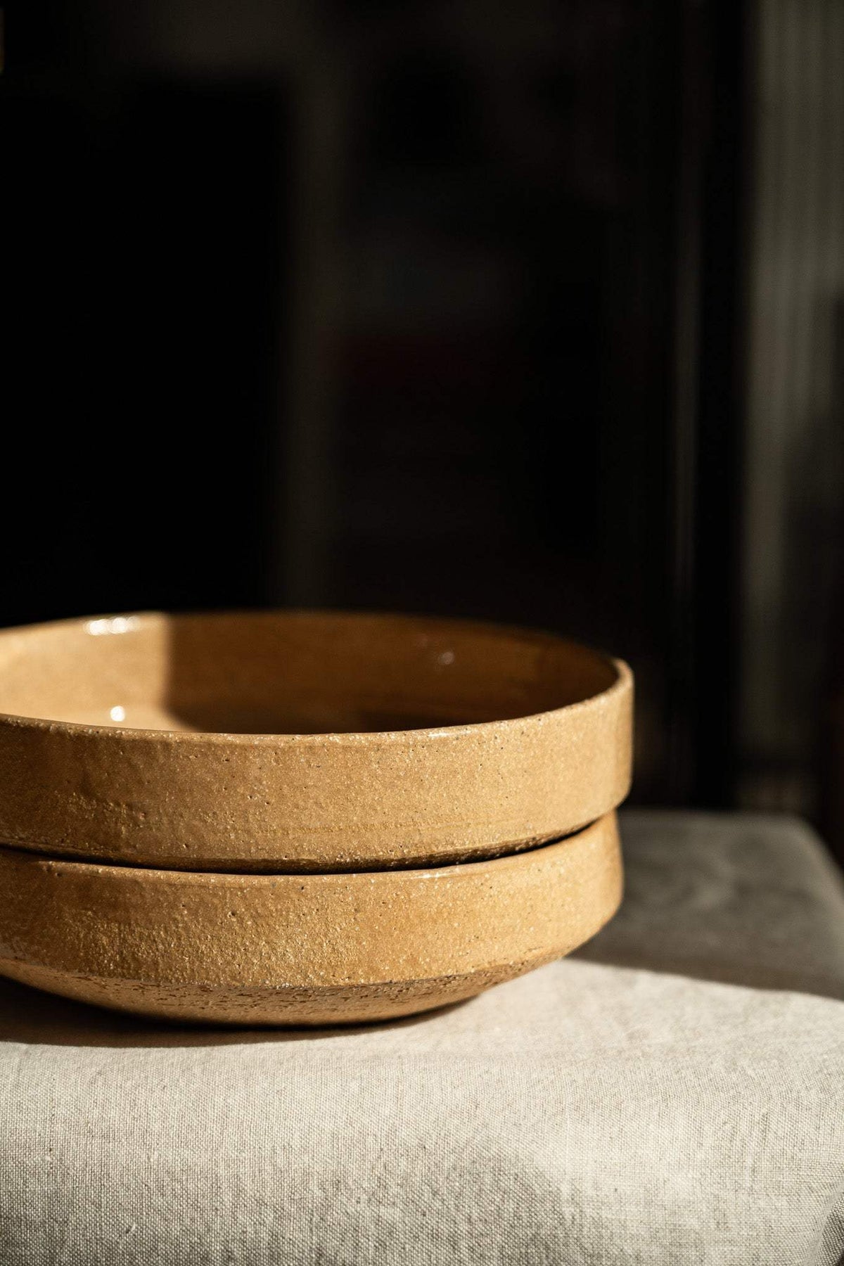 Handmade yellow clay stoneware breakfast bowl with natural speckles and glazed interior.