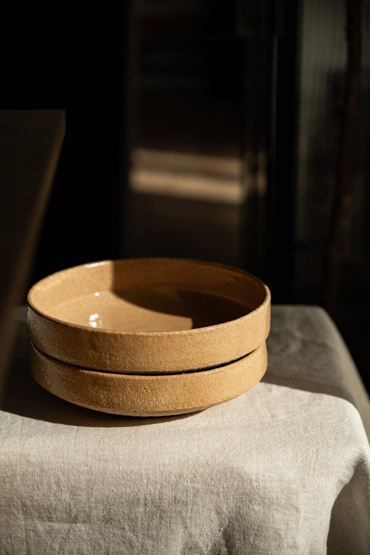 Handmade stoneware breakfast bowl in yellow clay with natural speckles and glazed interior