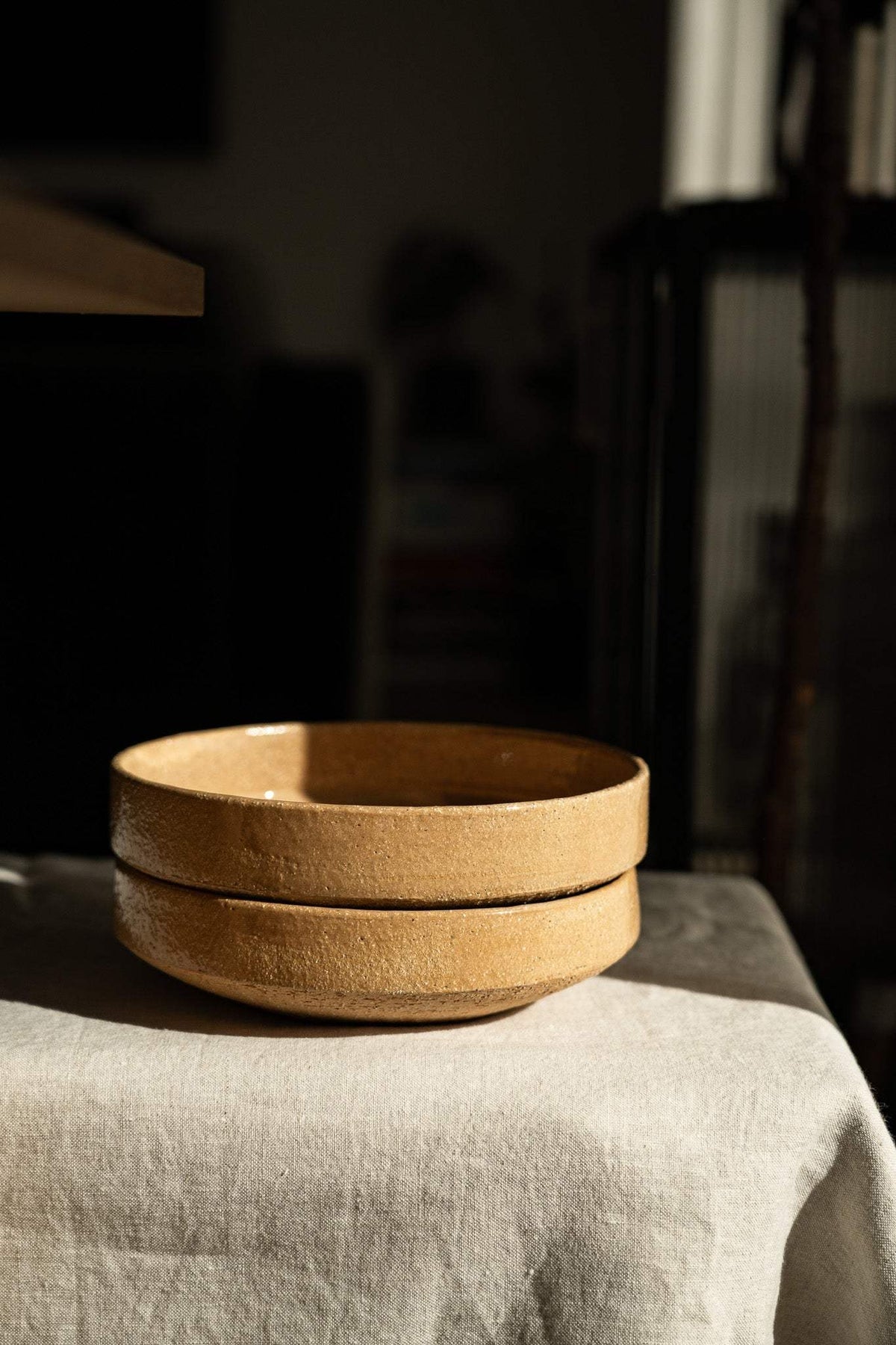 Handmade stoneware breakfast bowl in yellow clay with natural speckles and glazed interior