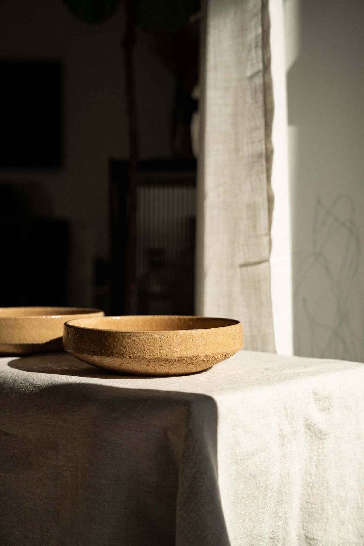 Handmade yellow stoneware breakfast bowl with natural speckles and glazed interior