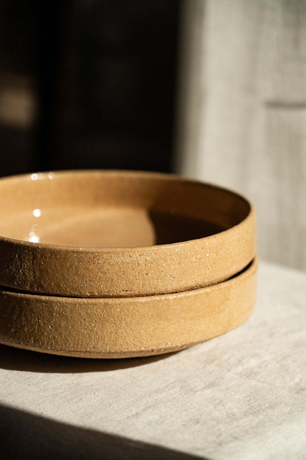 Handmade yellow stoneware breakfast bowl with natural speckles and glazed interior