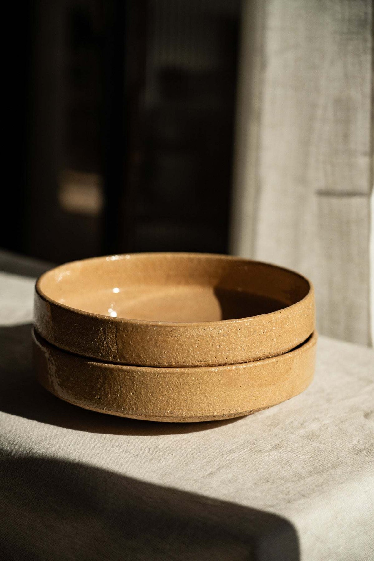 Handmade yellow stoneware breakfast bowl with natural speckles and glazed interior