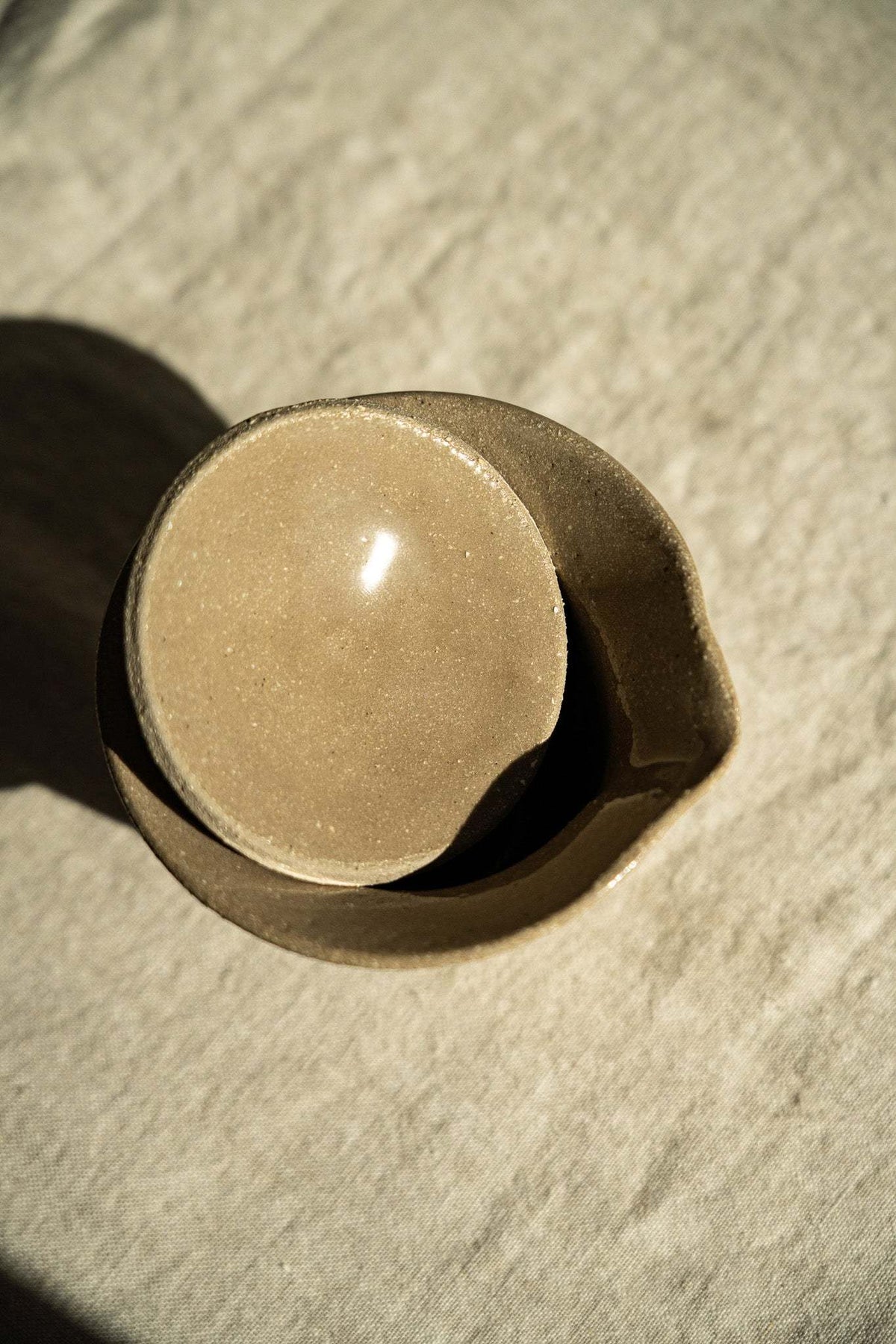 Handmade Stoneware Gaiwan in earthy gray-brown glazed ceramic with a fitted rounded lid and subtle speckles.