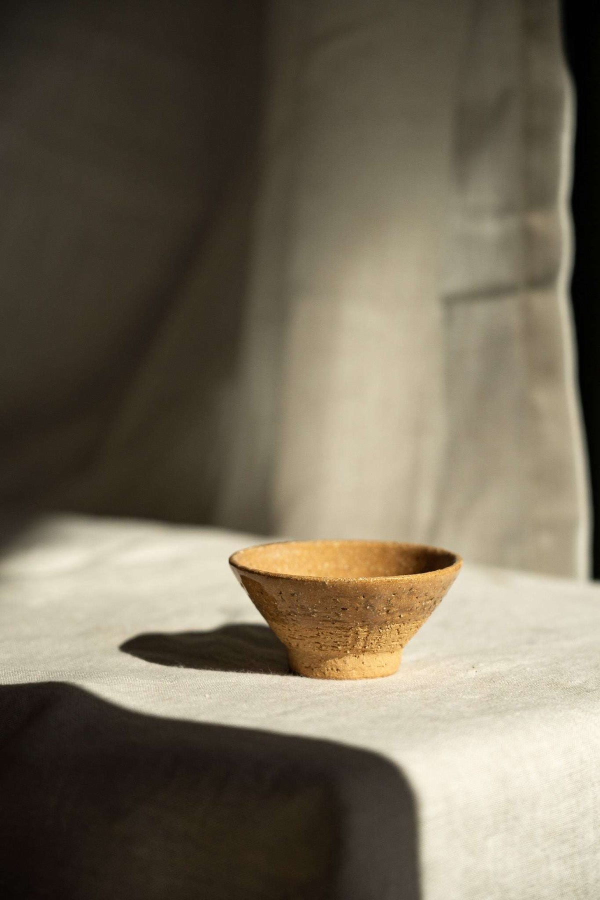 Handmade small yellow stoneware tea cup with white and grey speckles, glazed interior, textured exterior, perfect for tea ceremonies and everyday use