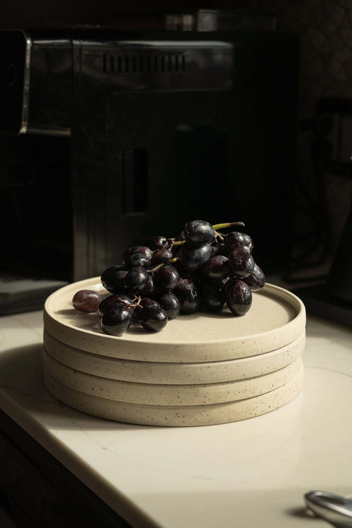 Stoneware Pottery Plate, cream-colored stoneware with fine dark speckles, a smooth rim and shallow center.