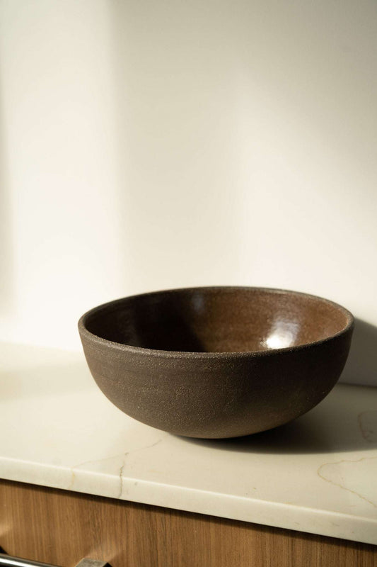 Stoneware Large Fruit Bowl in dark brown with a smooth glazed interior and subtly textured exterior.