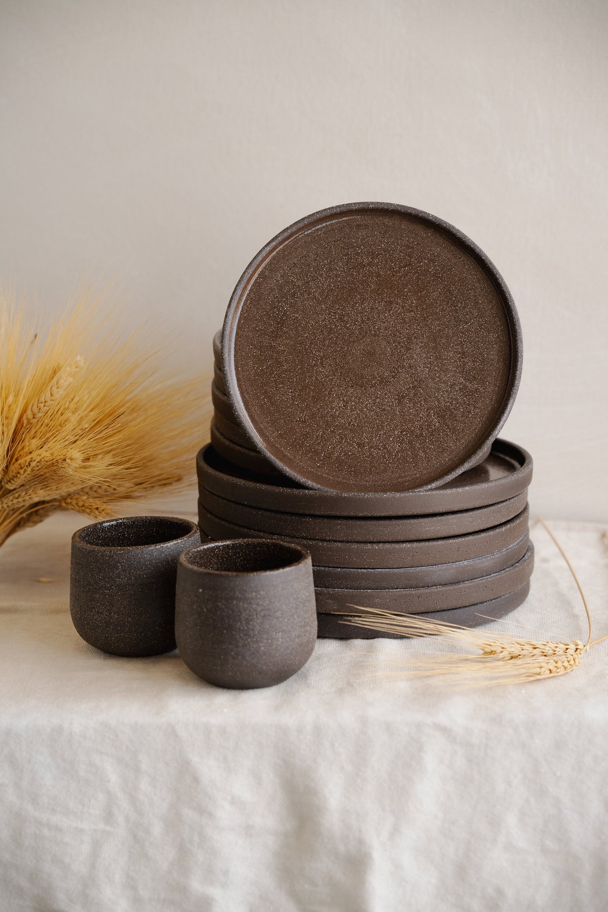 Handmade stoneware coffee cup in pumpernickel color with durable exterior and glazed interior