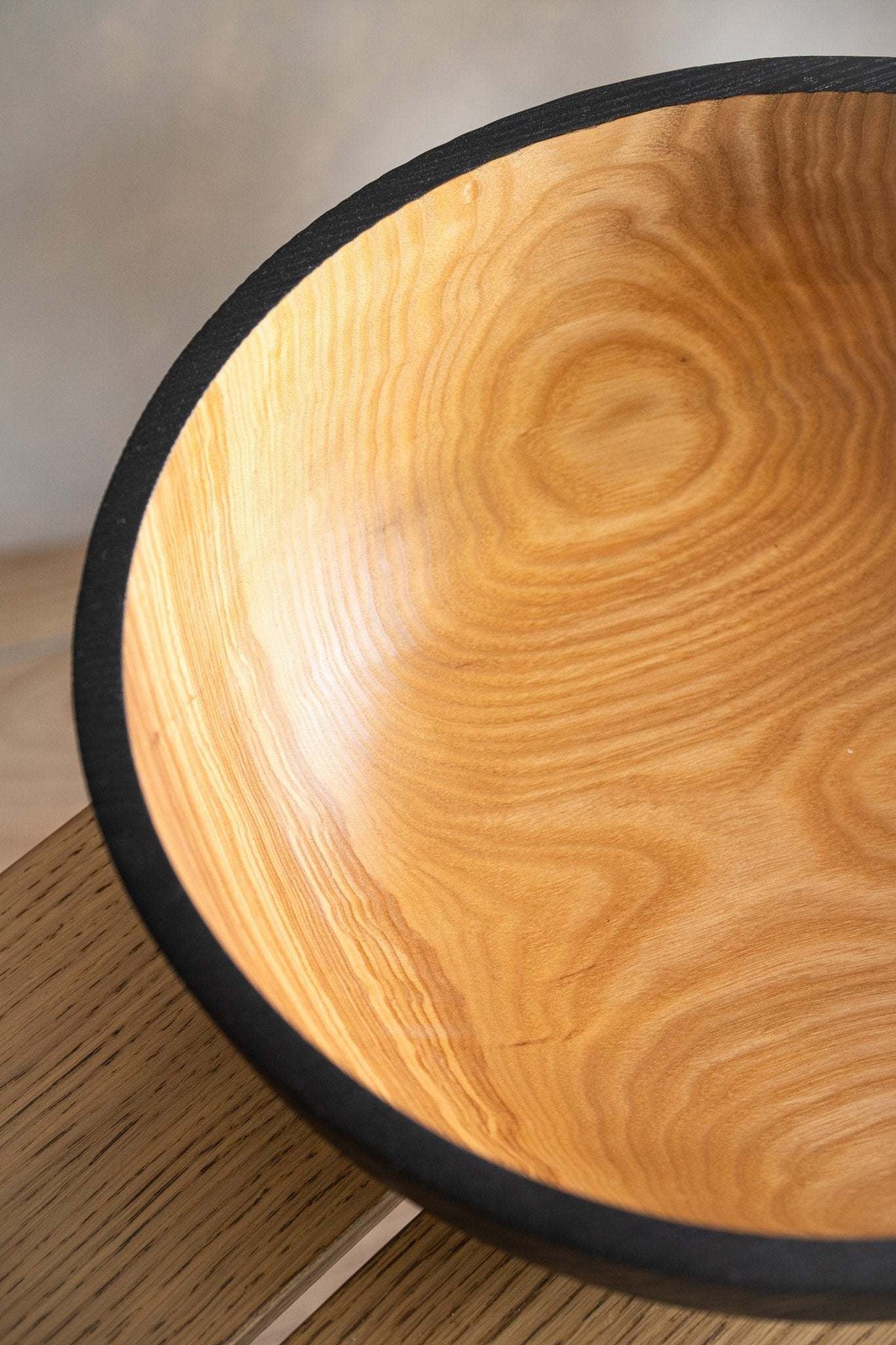 Hand carved extra large solid ash wood bowl with half charred black interior and durable exterior finish