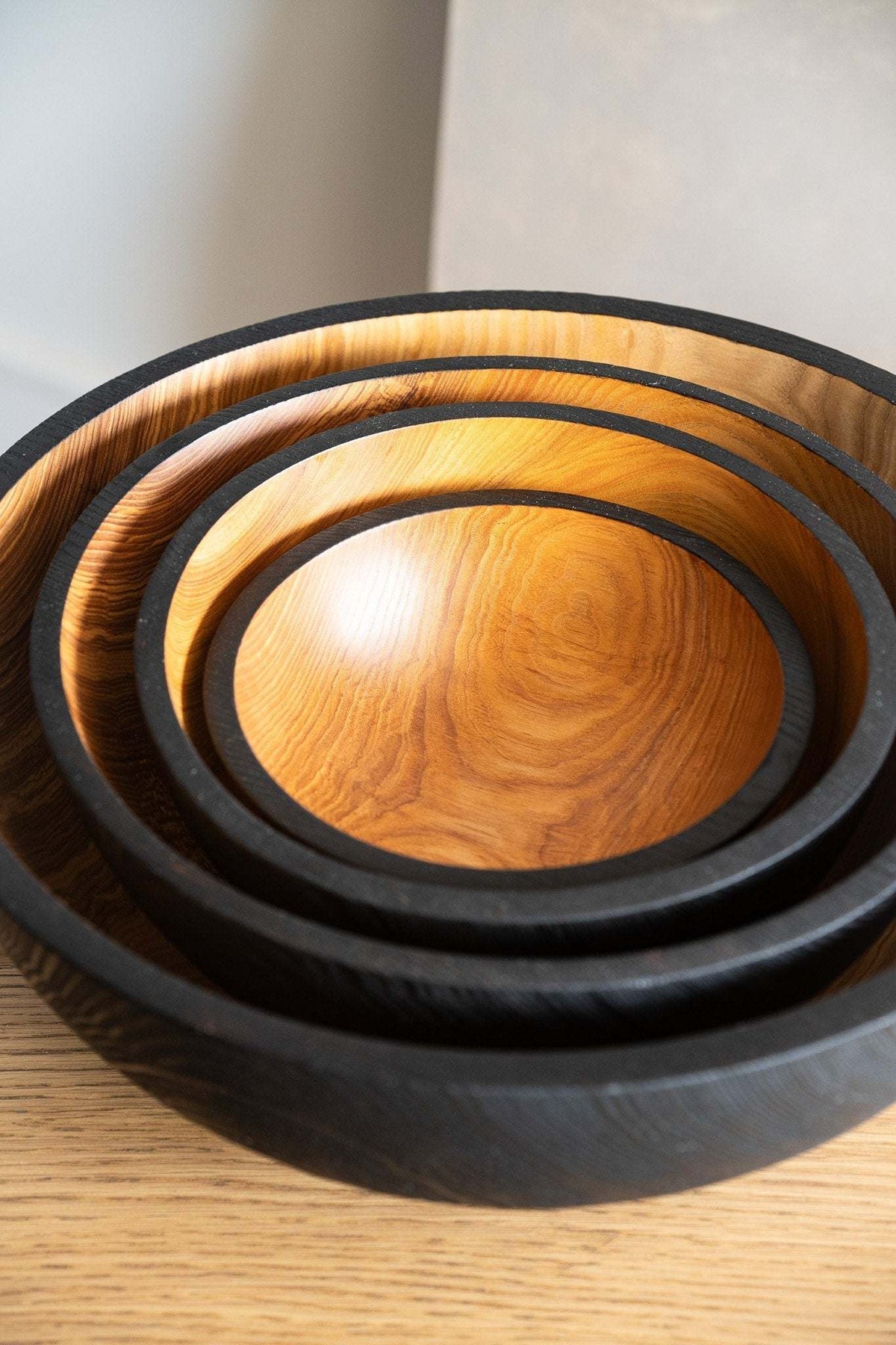 Hand carved extra large wooden bowl with half charred ash wood interior and durable exterior finish