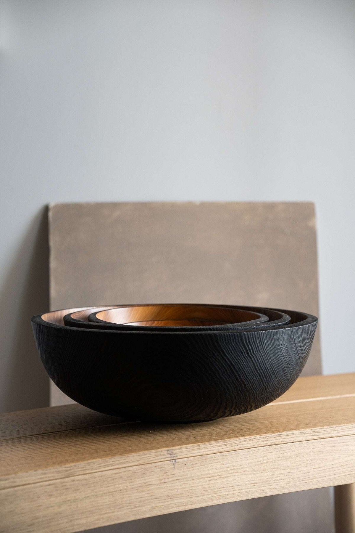 Hand carved extra large wooden bowl with half charred interior and exterior finish made from solid ash wood