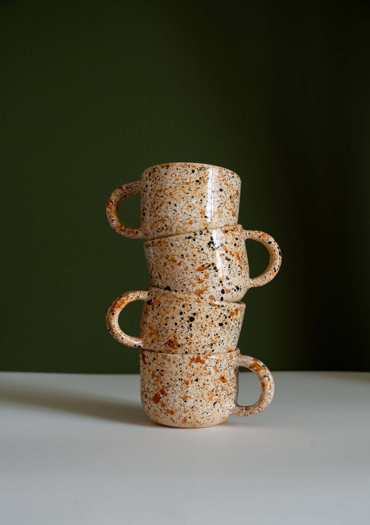 Hand painted personalized stoneware mug with double handle and splatter glaze design