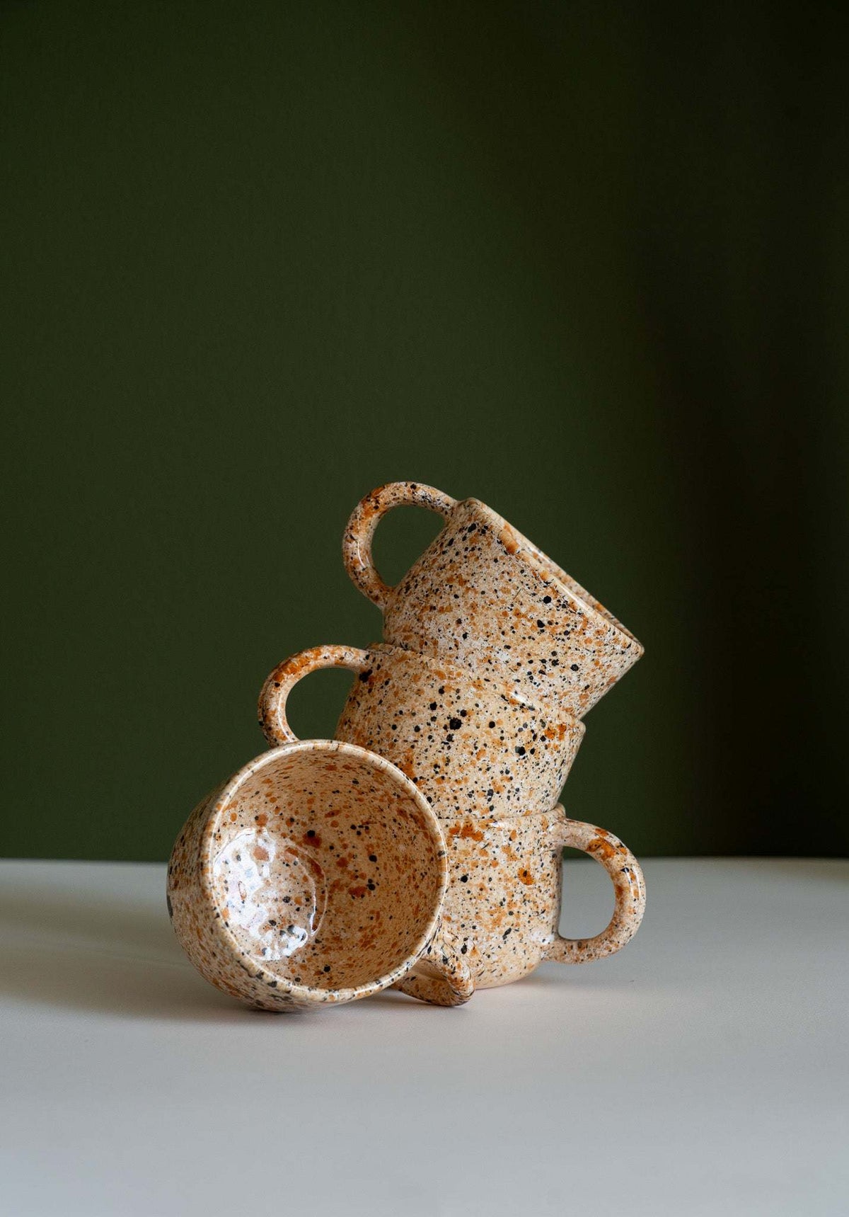Hand painted splatter ceramic personalized stoneware mug with double handle in earthy green glaze