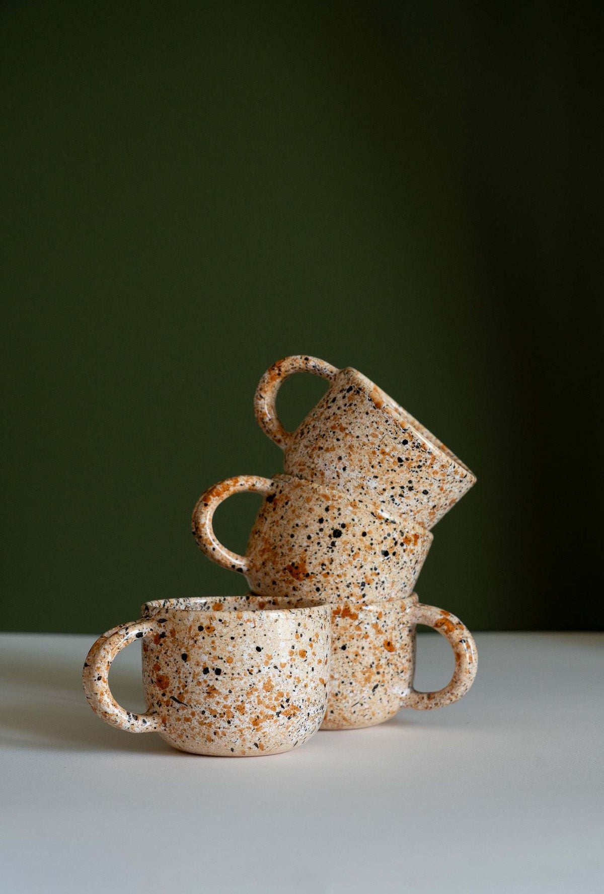 Hand painted personalized stoneware mug with double handle and splatter glaze design