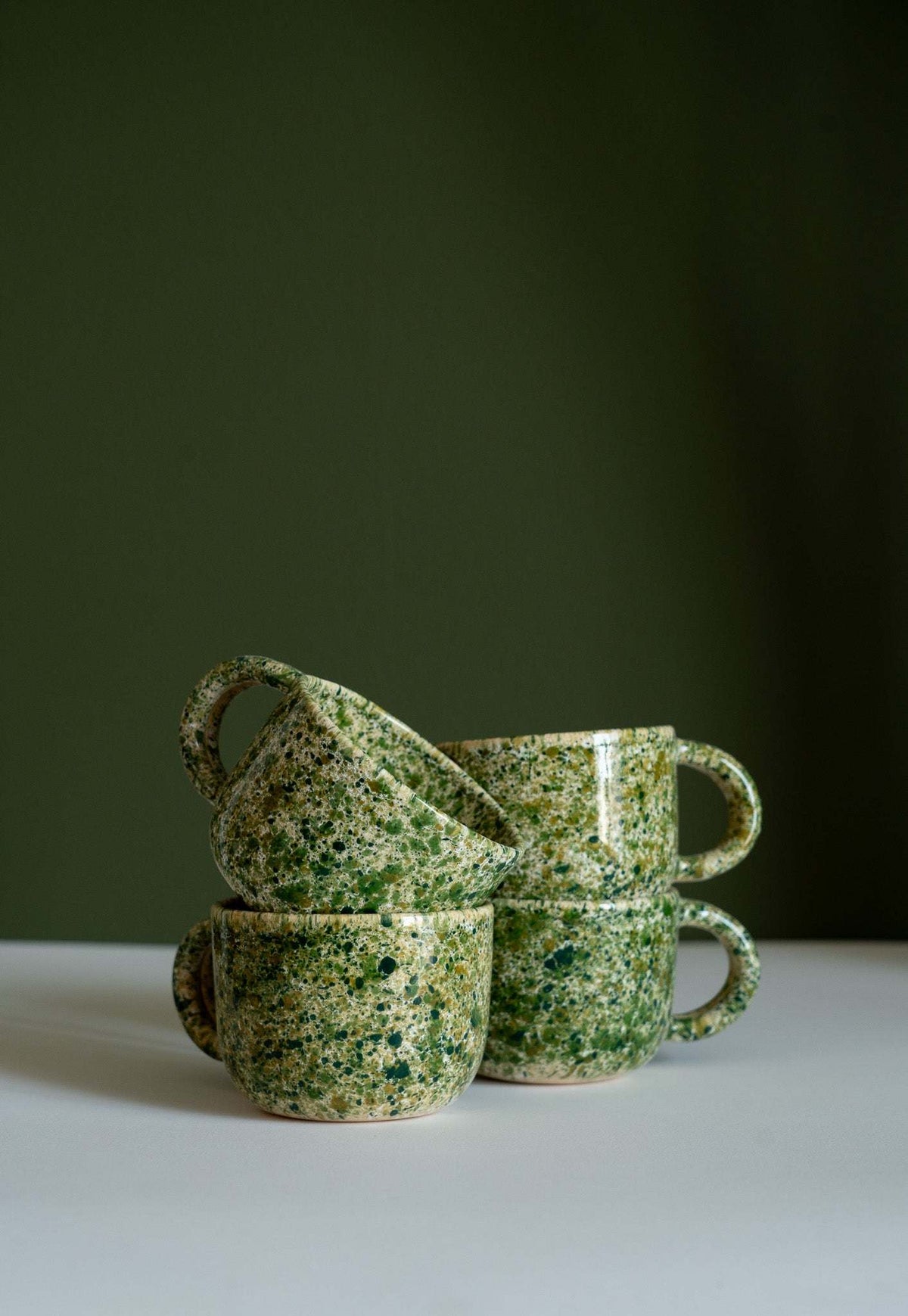 Hand painted personalized stoneware mug with double handle and speckled splatter glaze design