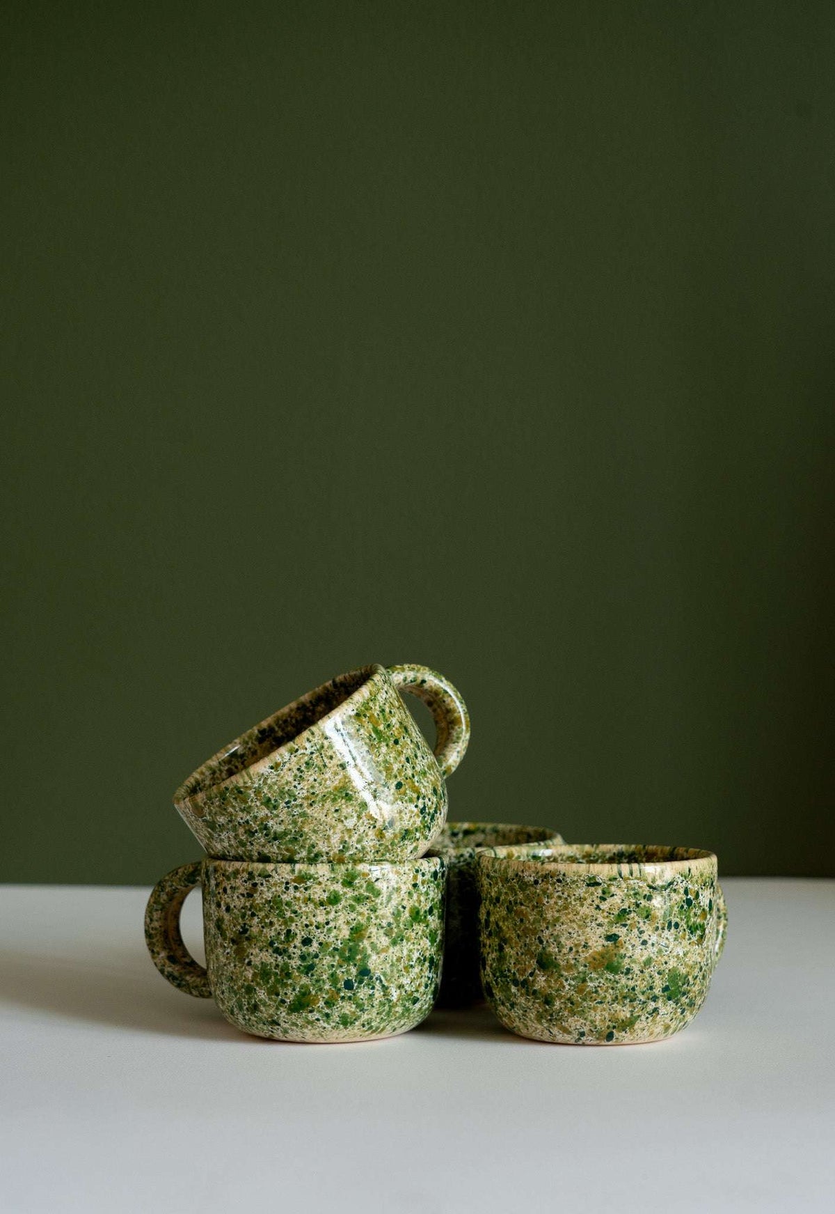 Hand painted personalized stoneware mug with double handles and organic splatter glaze design