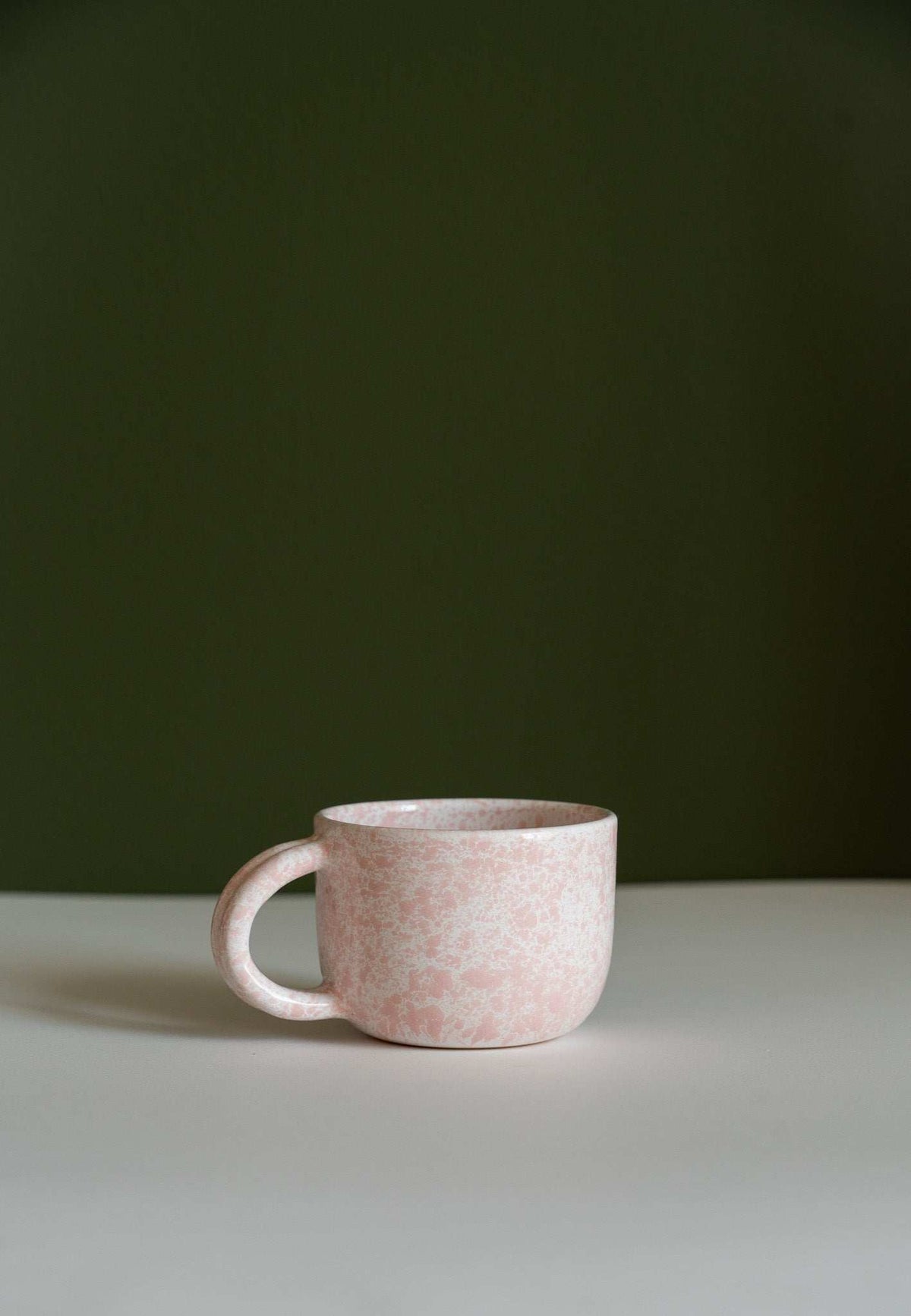 Hand painted personalized stoneware mug with double handle and splatter glaze design