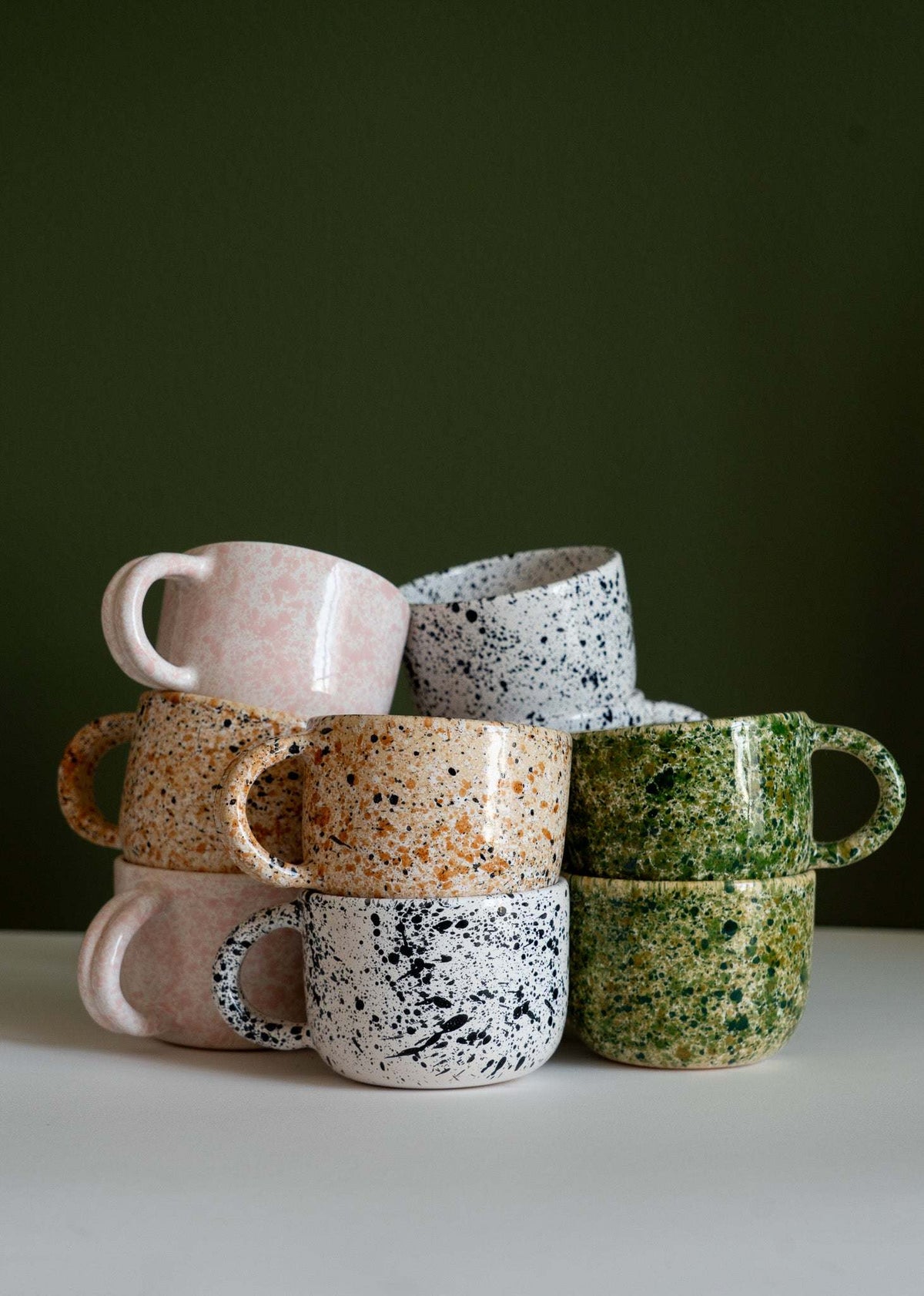 Hand painted splatter ceramic mug with double handle in personalized stoneware design