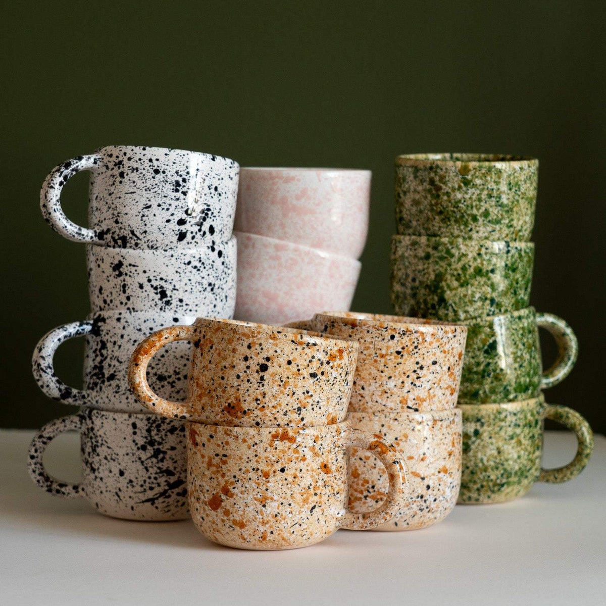 Hand painted splatter ceramic personalized stoneware mug with double handle showcasing unique artisan glaze and glossy finish