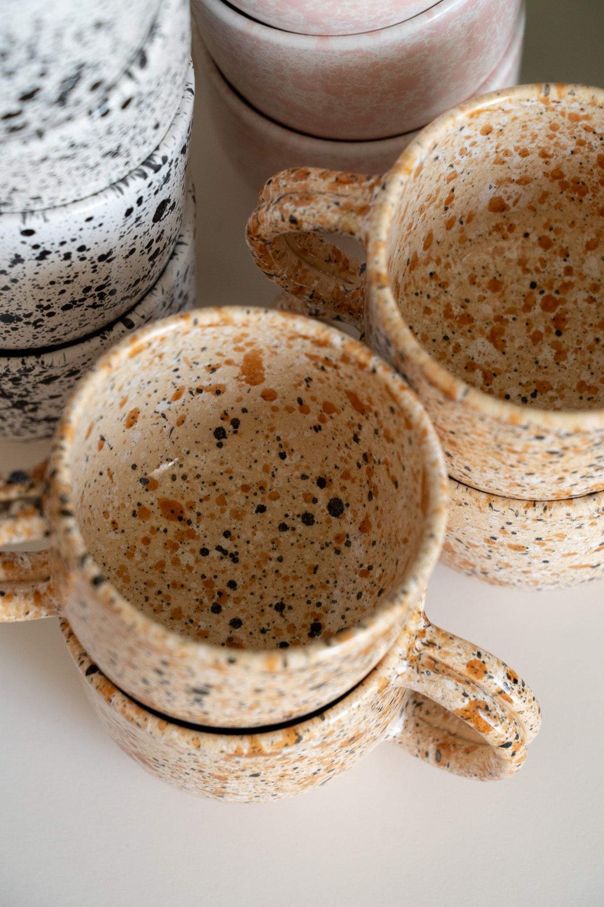 Hand painted personalized stoneware mug with double handle and splatter glaze design