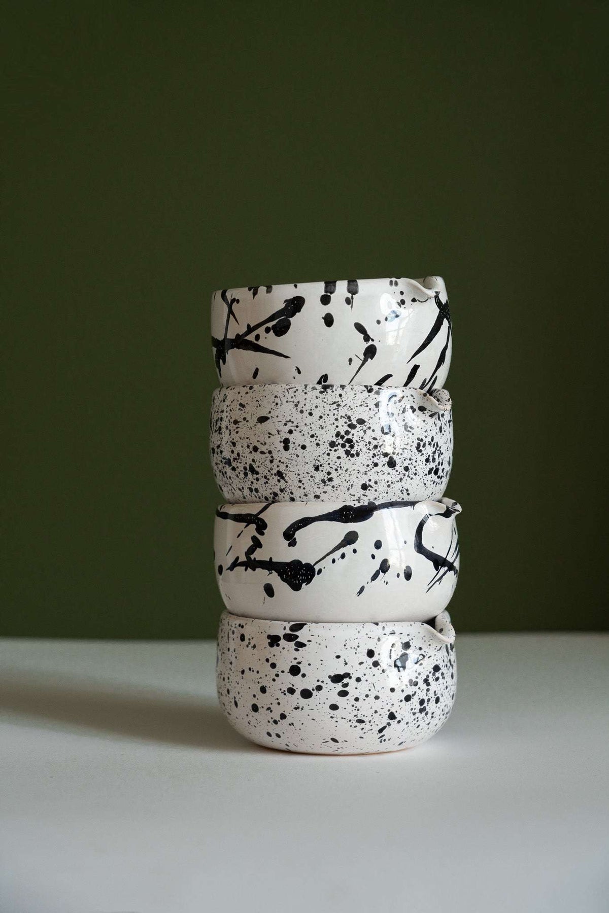 Handmade Matcha Bowl set of four white stoneware bowls with black speckles and bold brushstroke patterns, hand-glazed finish