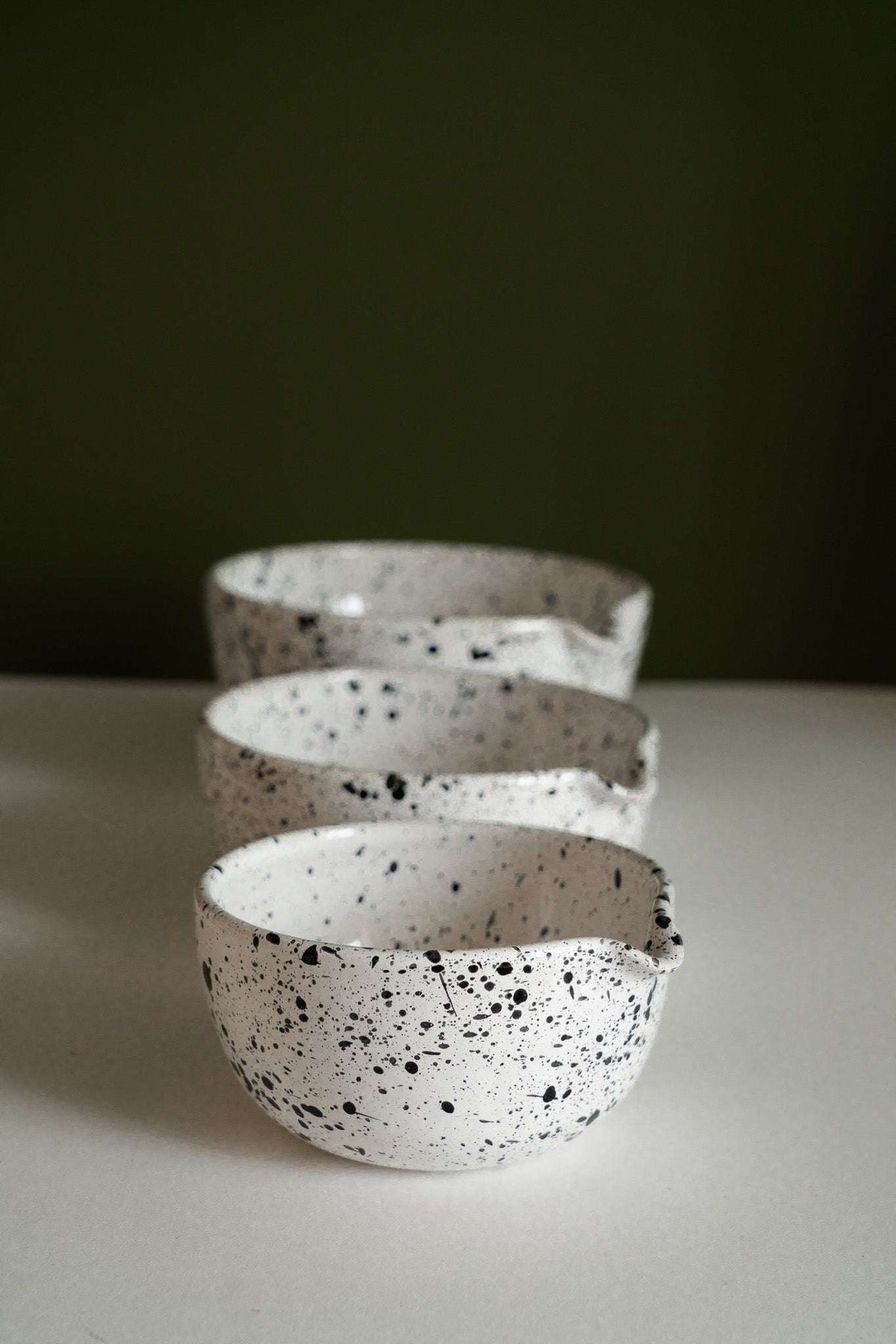 Deep stoneware mixing and serving nesting bowl set with pour spouts and artisanal speckled finish